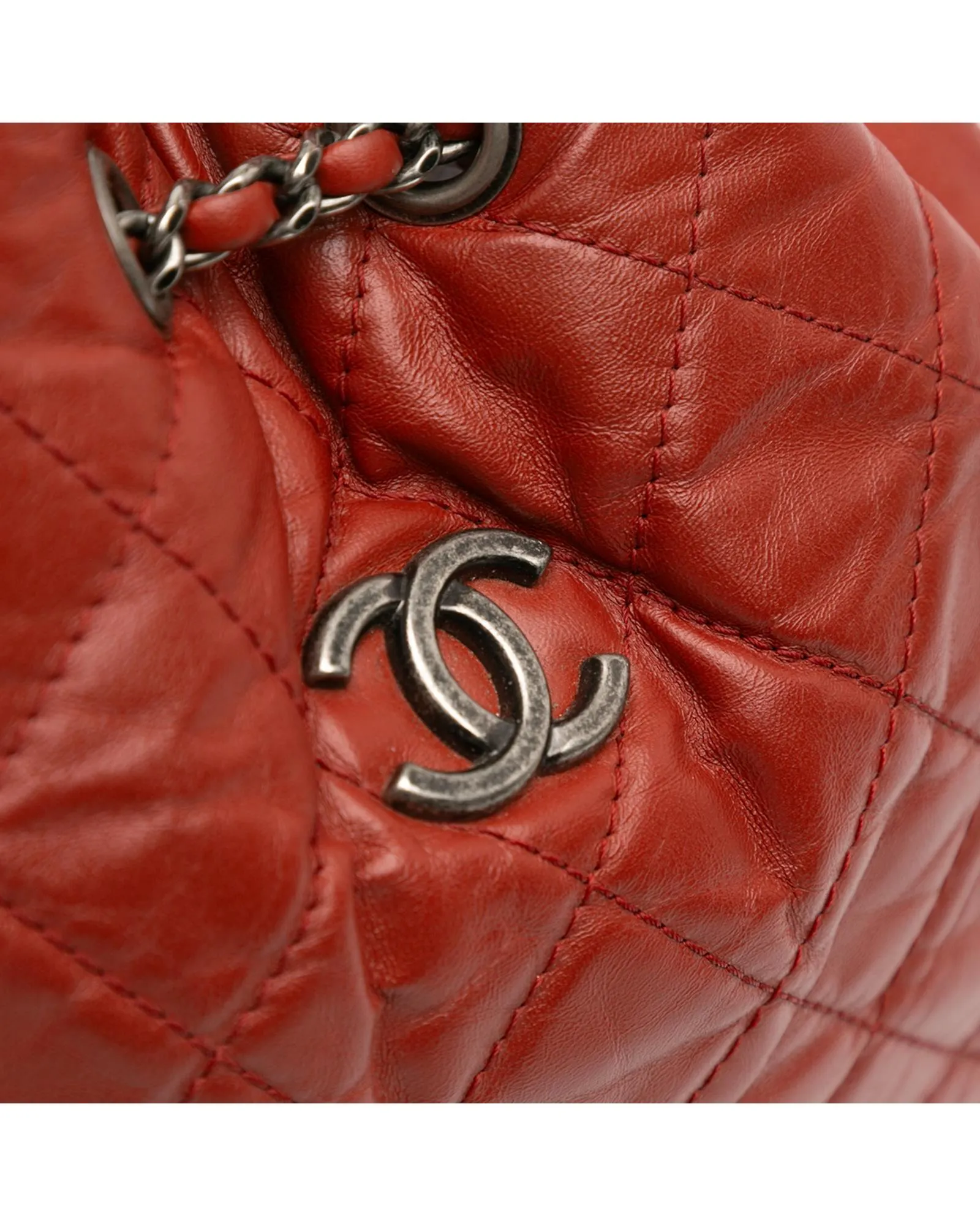 Aged Calfskin Leather Backpack with Chain Straps and Drawstring Closure